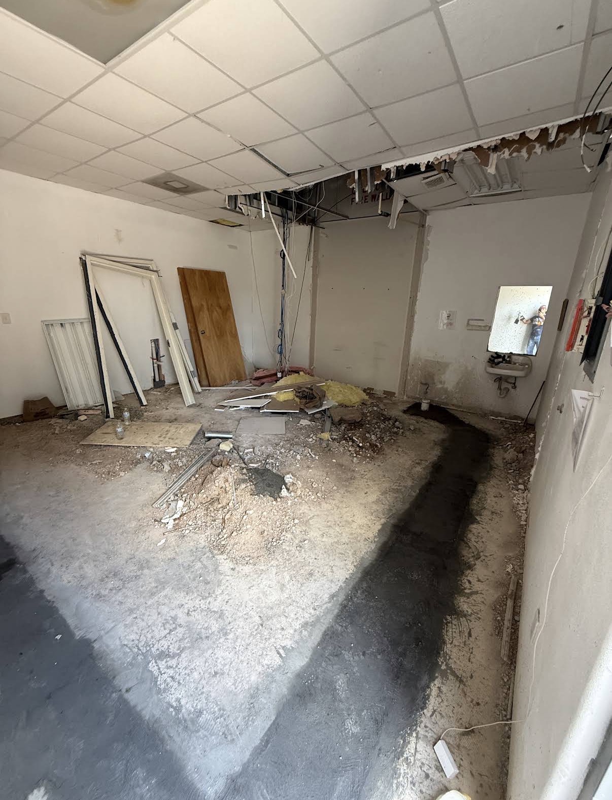 Property before clean-out — debris and demolition mess
